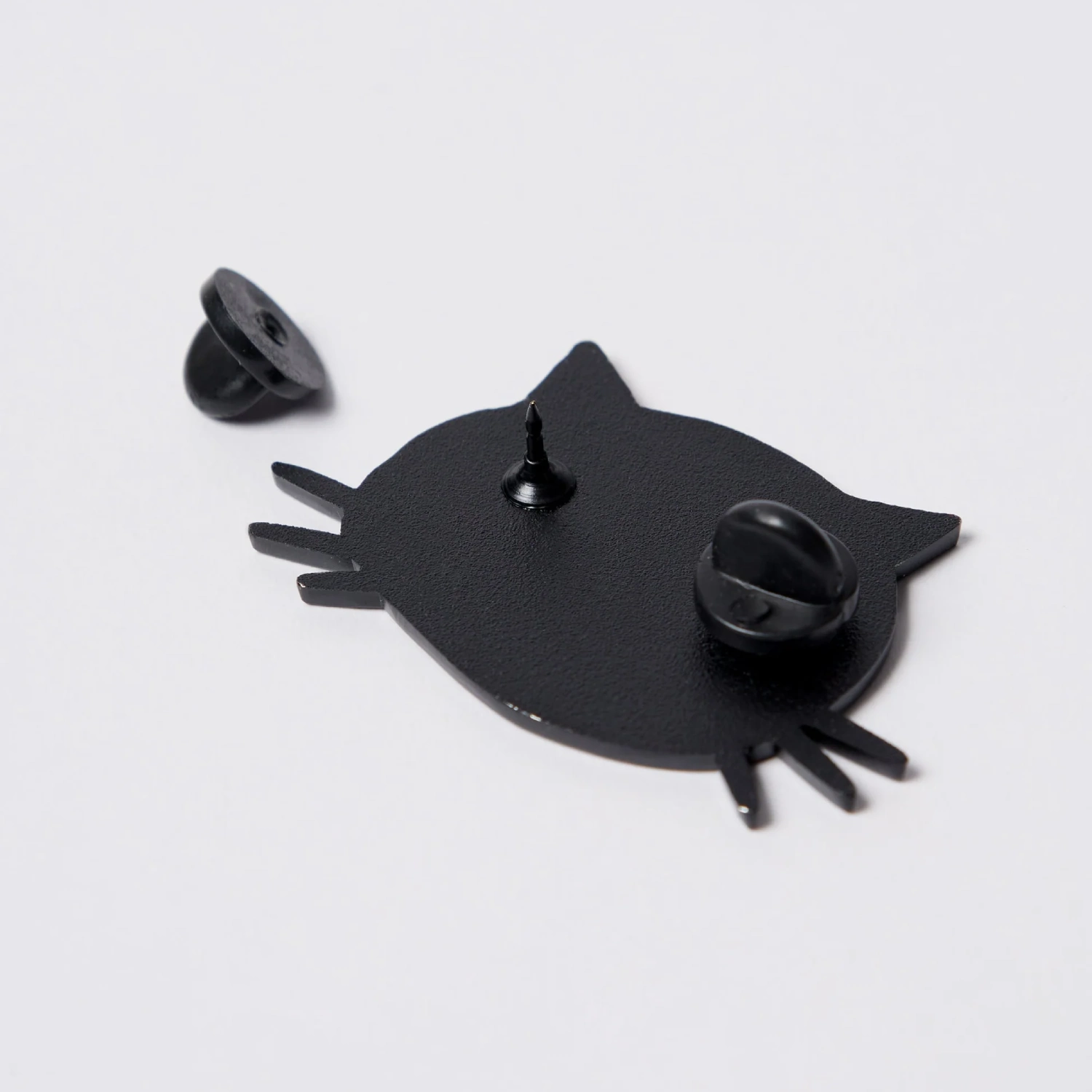 by Parra Sad Cat Enamel Pin back view in a white background