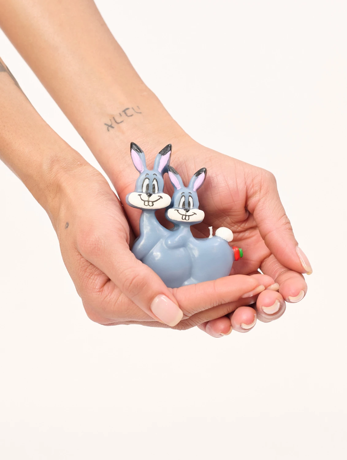 Carne Bollente Rabbits by Olga Goose Candles front view with model