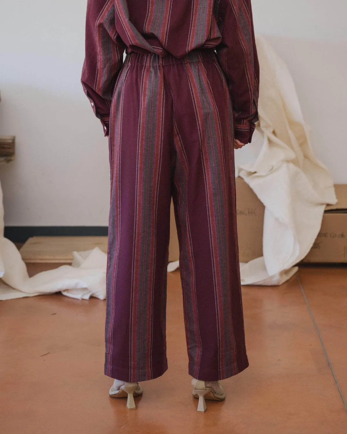 Baserange Claude Pants Maroon Stripe back view on model