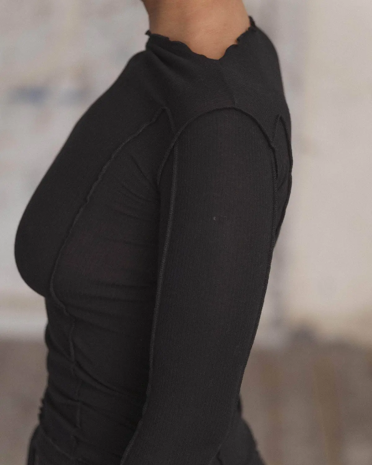 Baserange Omato Long Sleeve Black side view detail on model