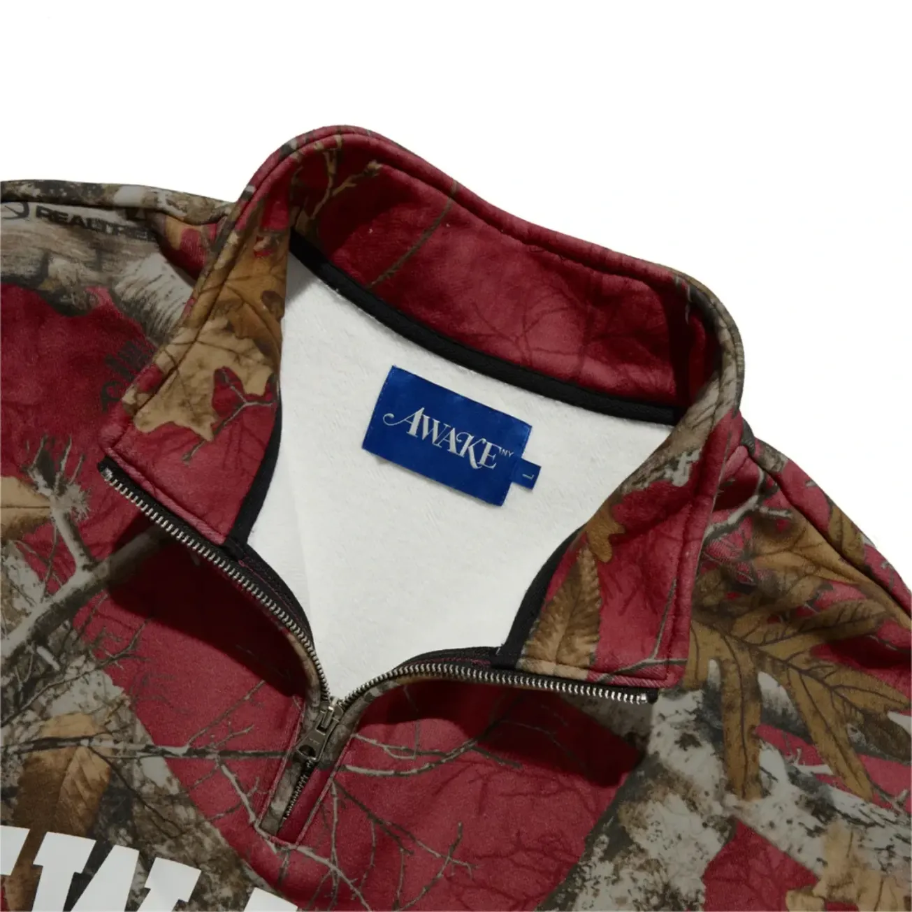 Awake NY New York Arch Quarter Zip Merlot front view detail in a white background