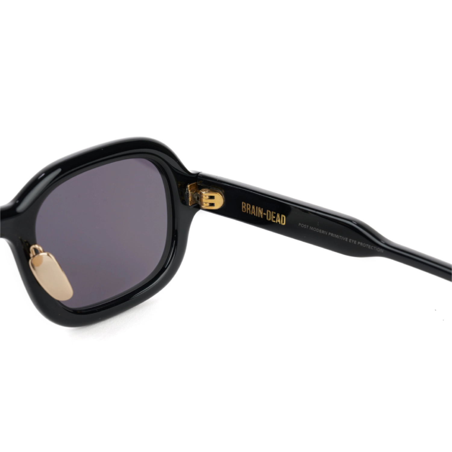 Brain Dead Newman Post Modern Primitive Eye Protection Black inner view in a white background