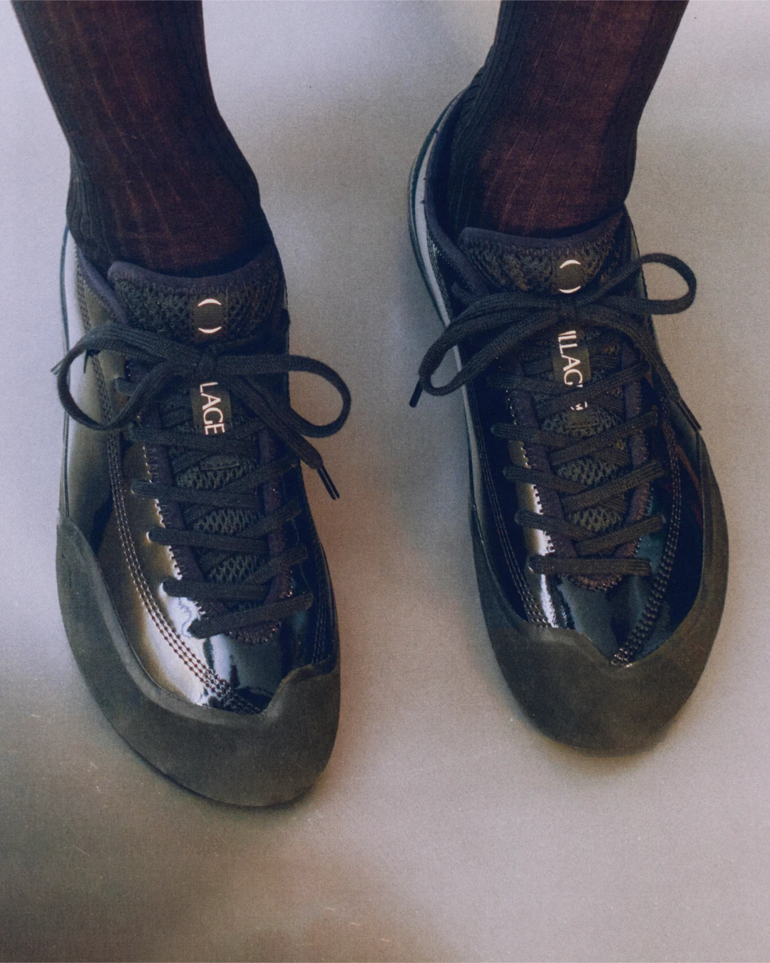 Village PM 1.30PM Gloss Black top view on model