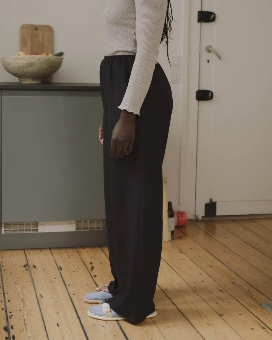 Baserange Stoa Pants Black side view on model