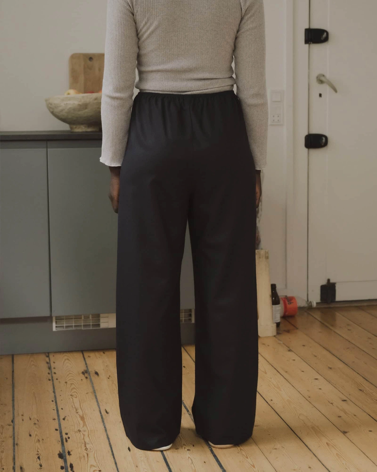 Baserange Stoa Pants Black back view on model