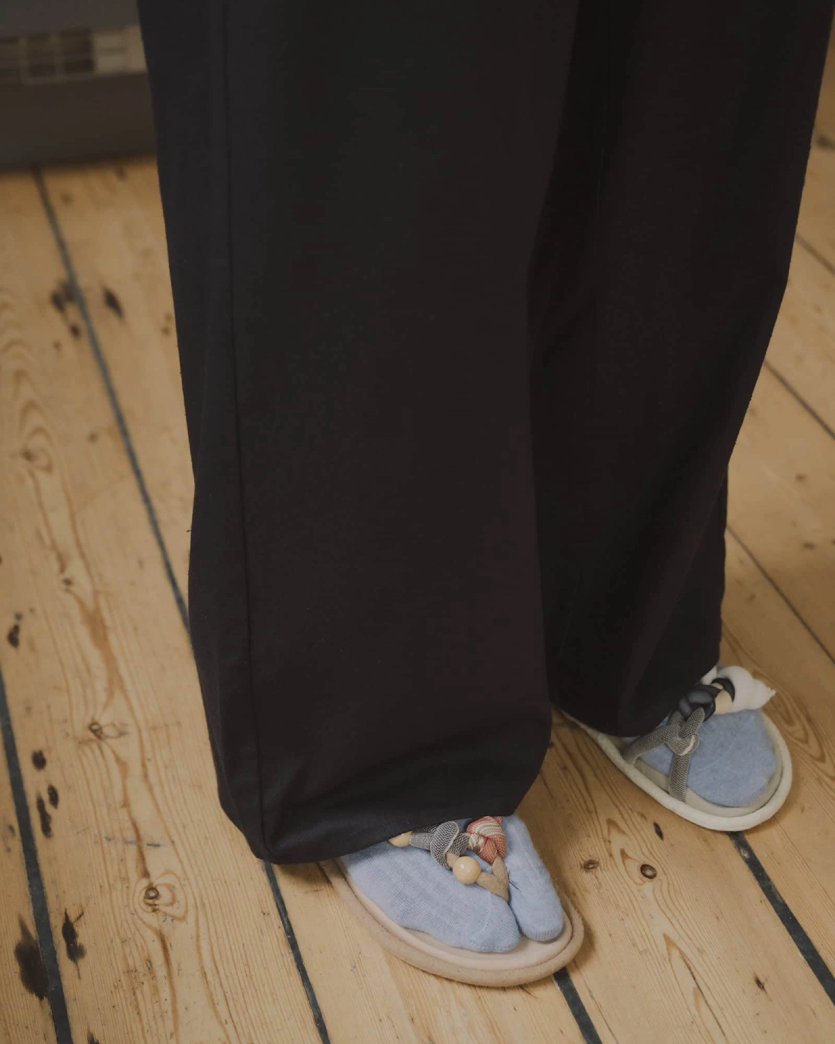 Baserange Stoa Pants Black hem detail on model