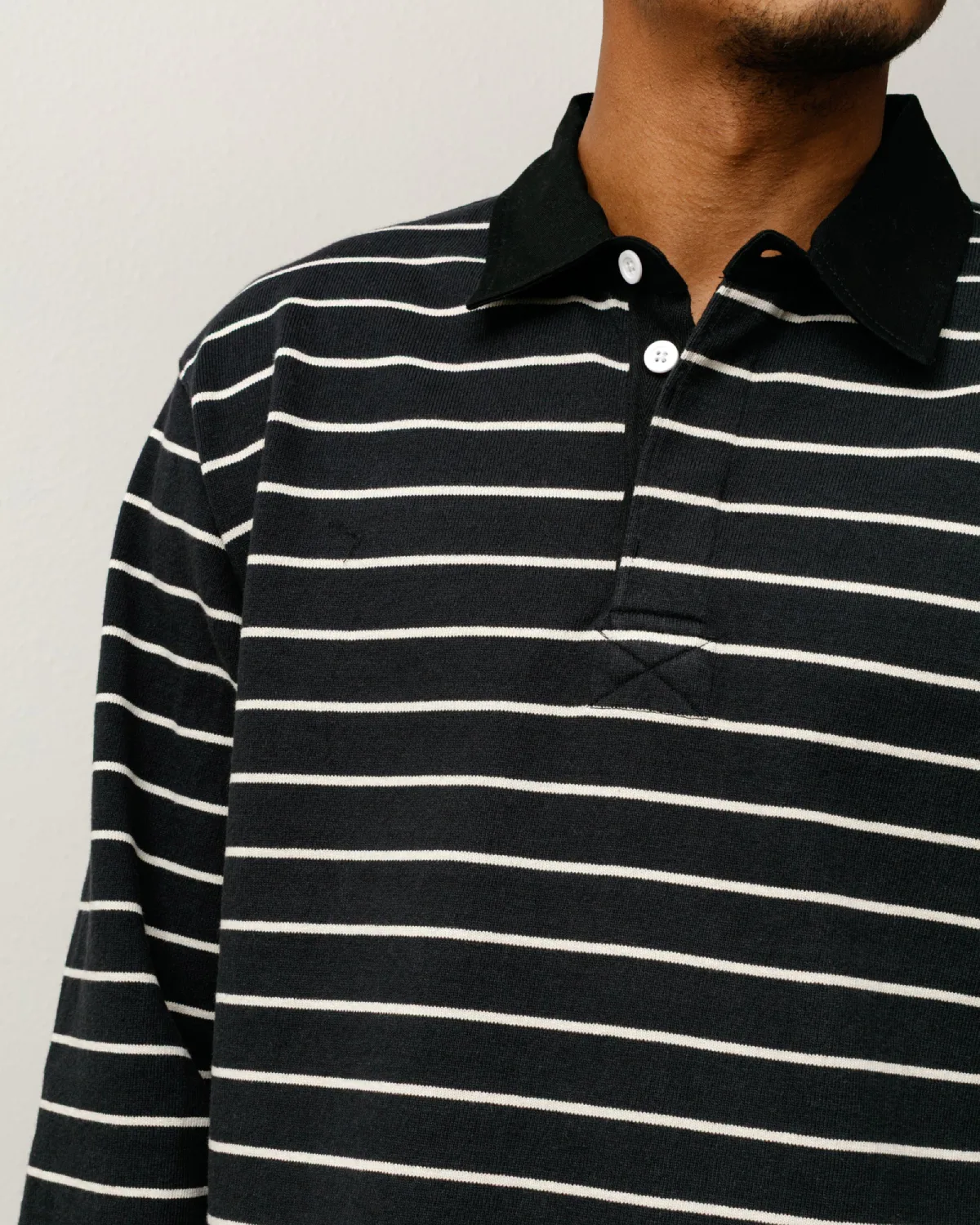 Stüssy Pin Striped Rugby Black front view detail on model
