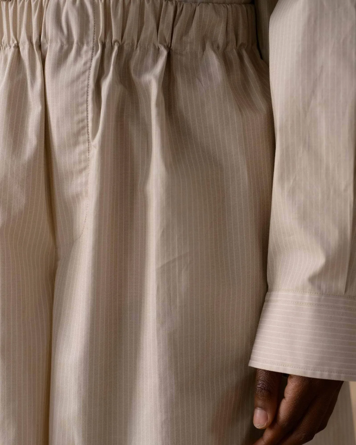 Baserange Claude Shorts Brown Stripe front view detail on model