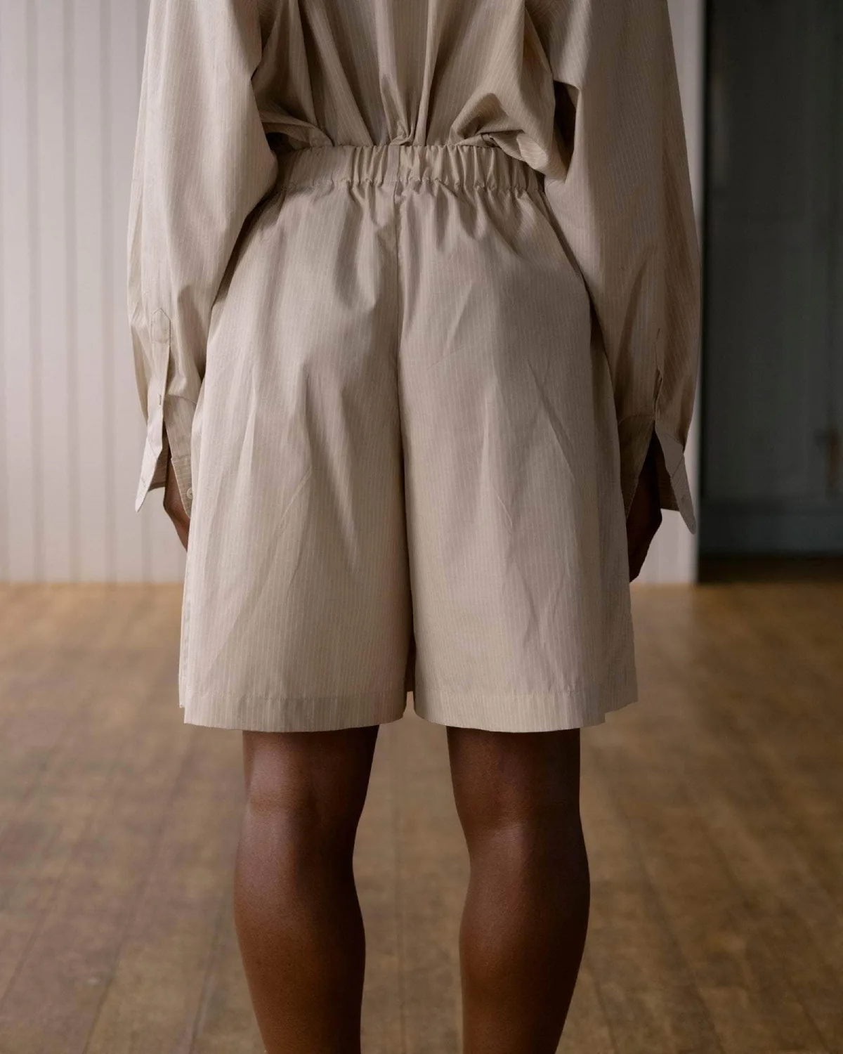 Baserange Claude Shorts Brown Stripe back view detail on model