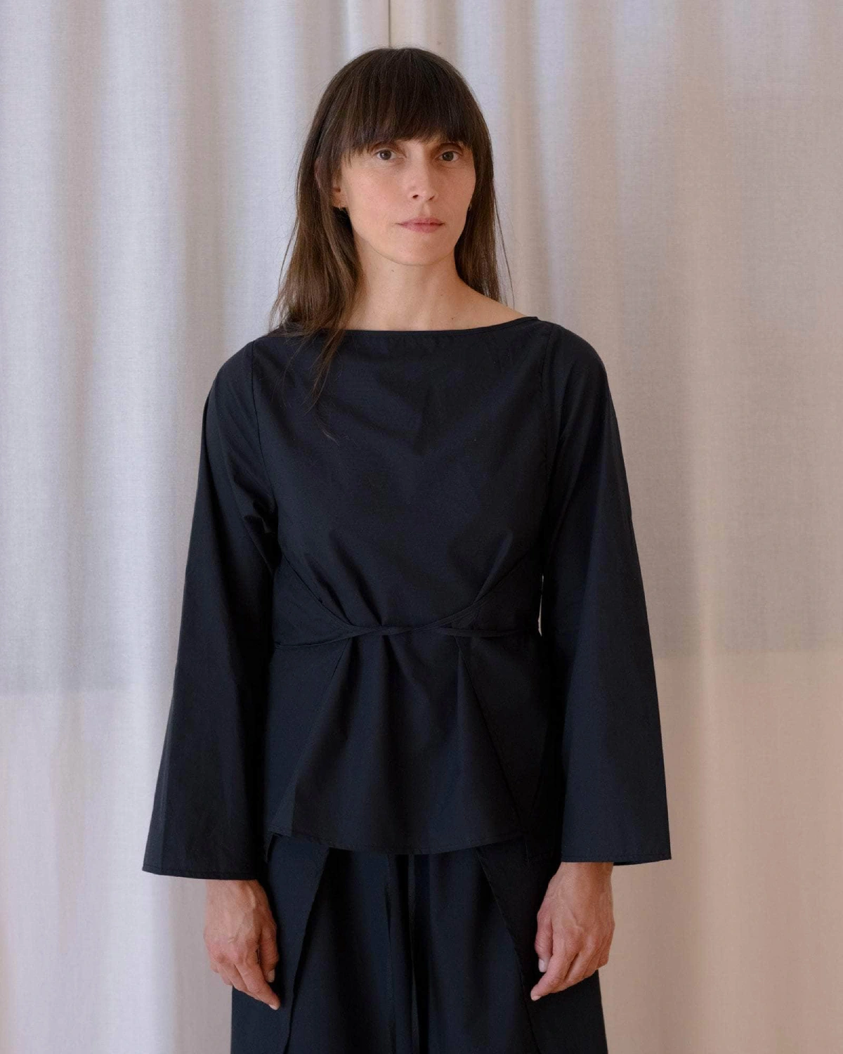 Baserange Decti Long Sleeve Top Black front view on model