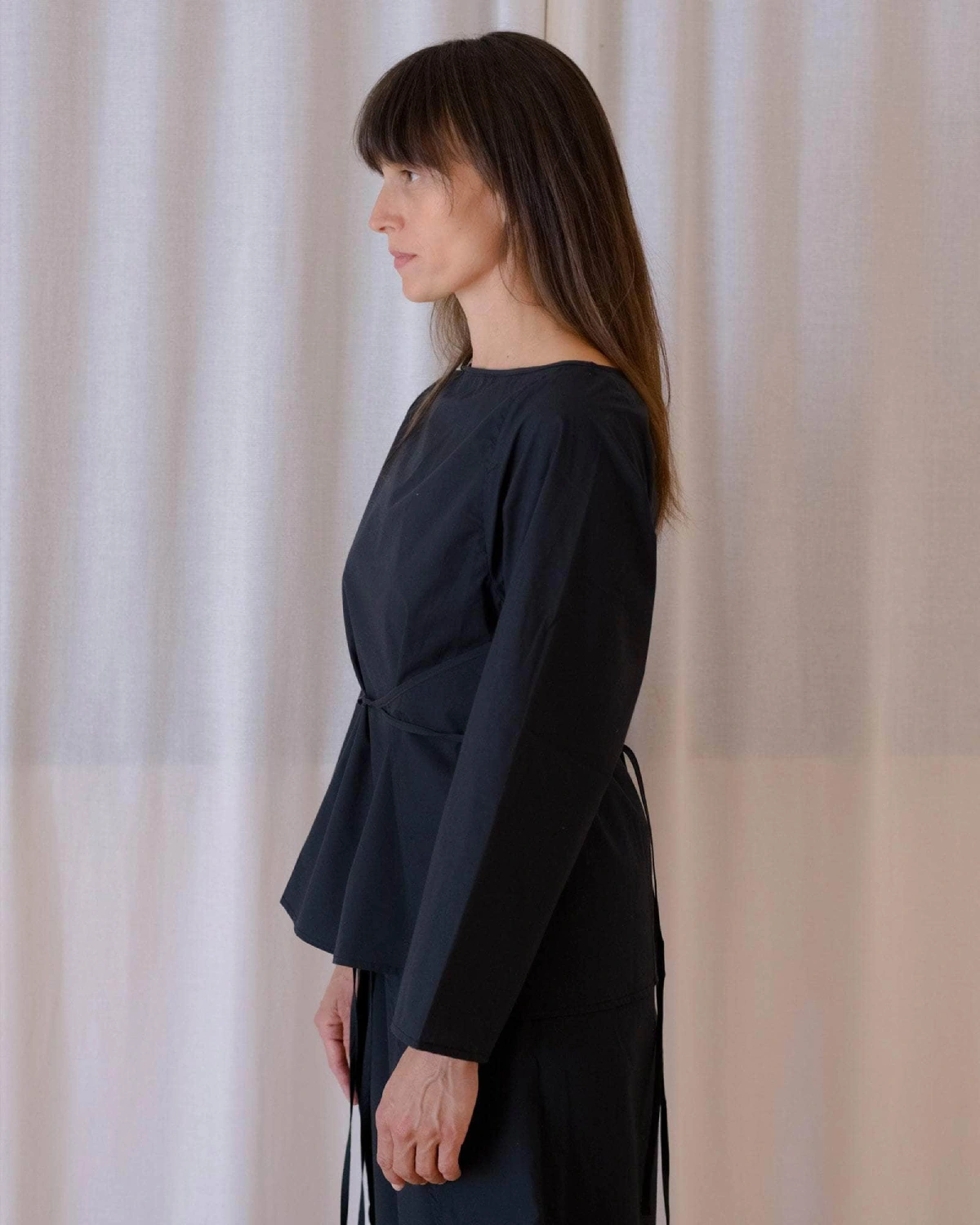 Baserange Decti Long Sleeve Top Black side view on model