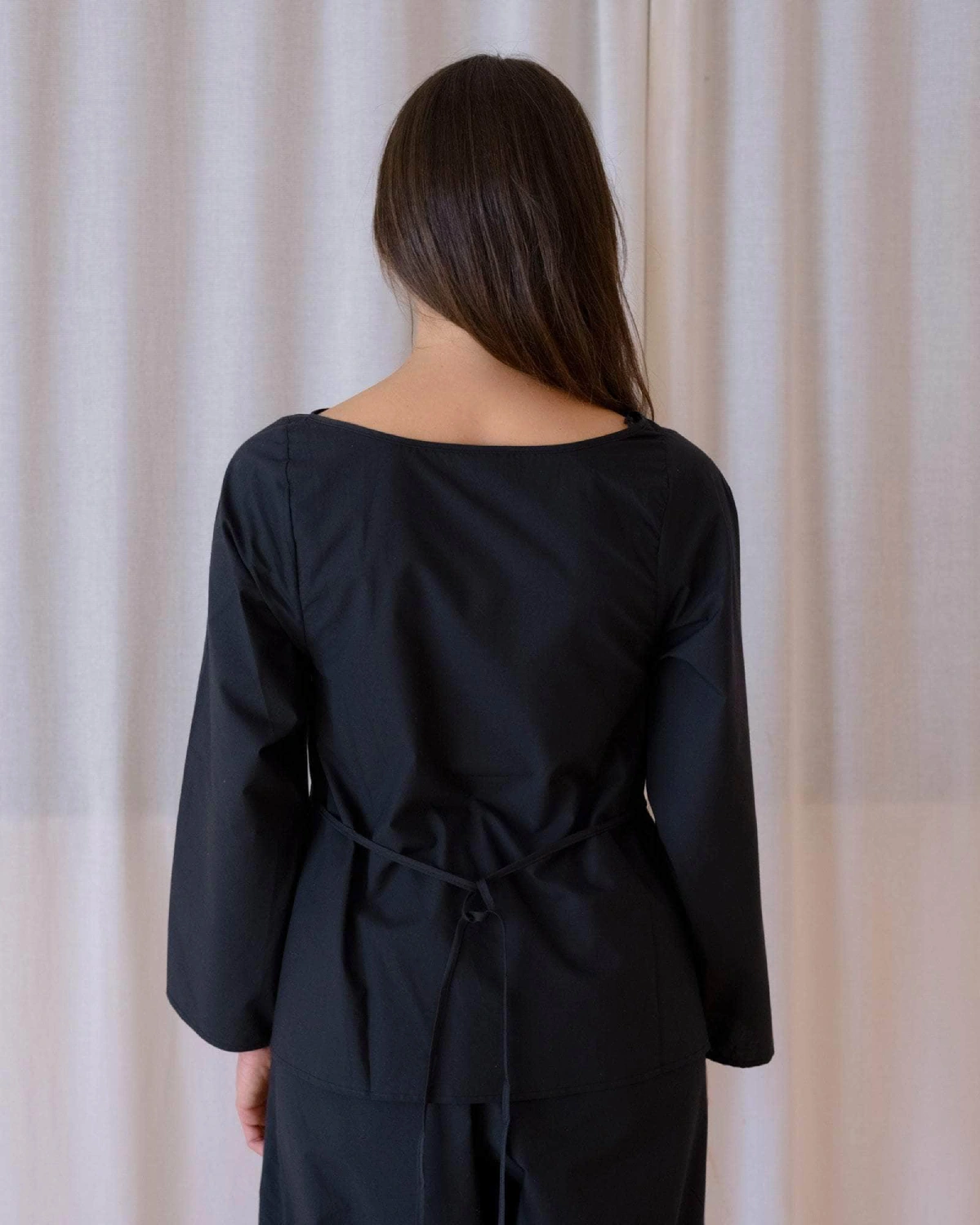 Baserange Decti Long Sleeve Top Black back view on model