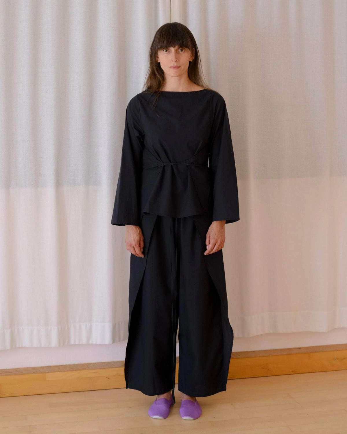 Baserange Decti Long Sleeve Top Black front view on model