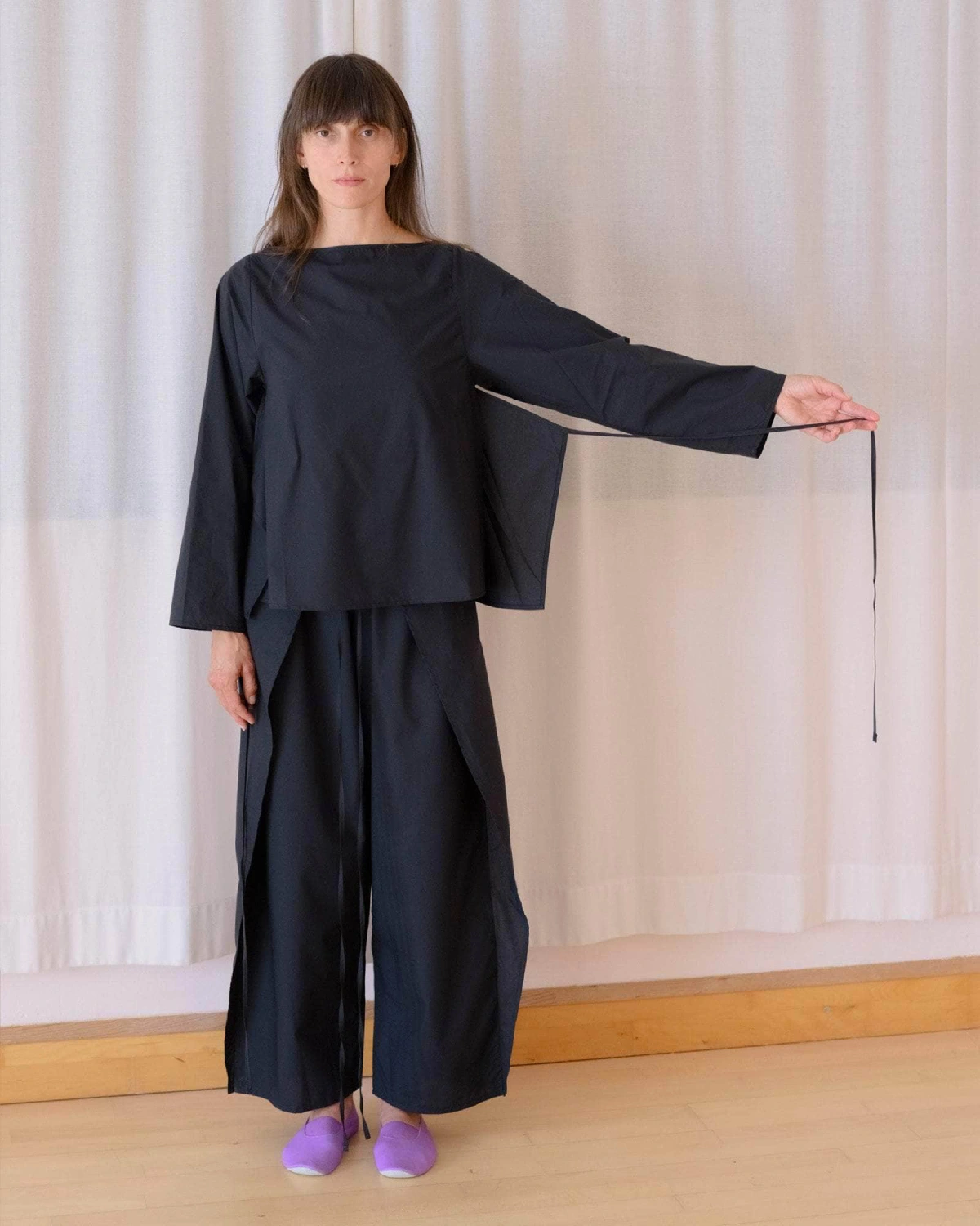 Baserange Decti Long Sleeve Top Black front view on model