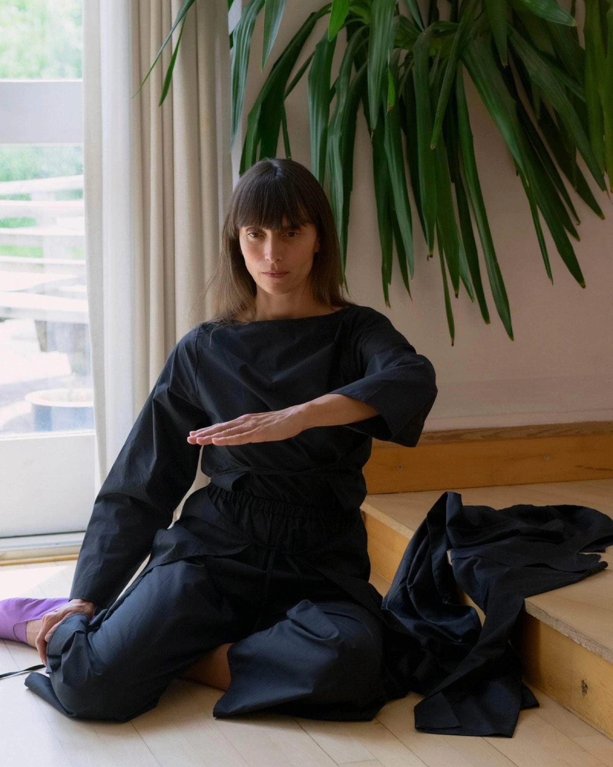 Baserange Decti Long Sleeve Top Black front view on model