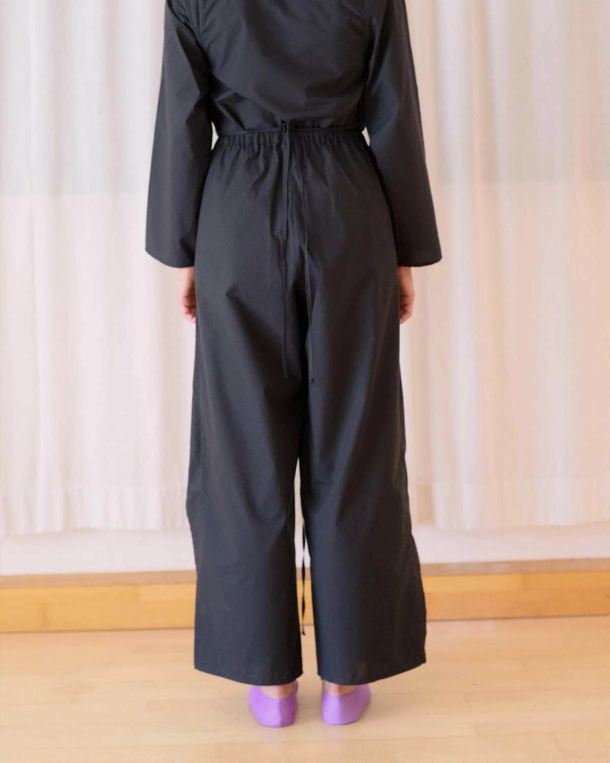 Baserange Decti Pants Black back view on model