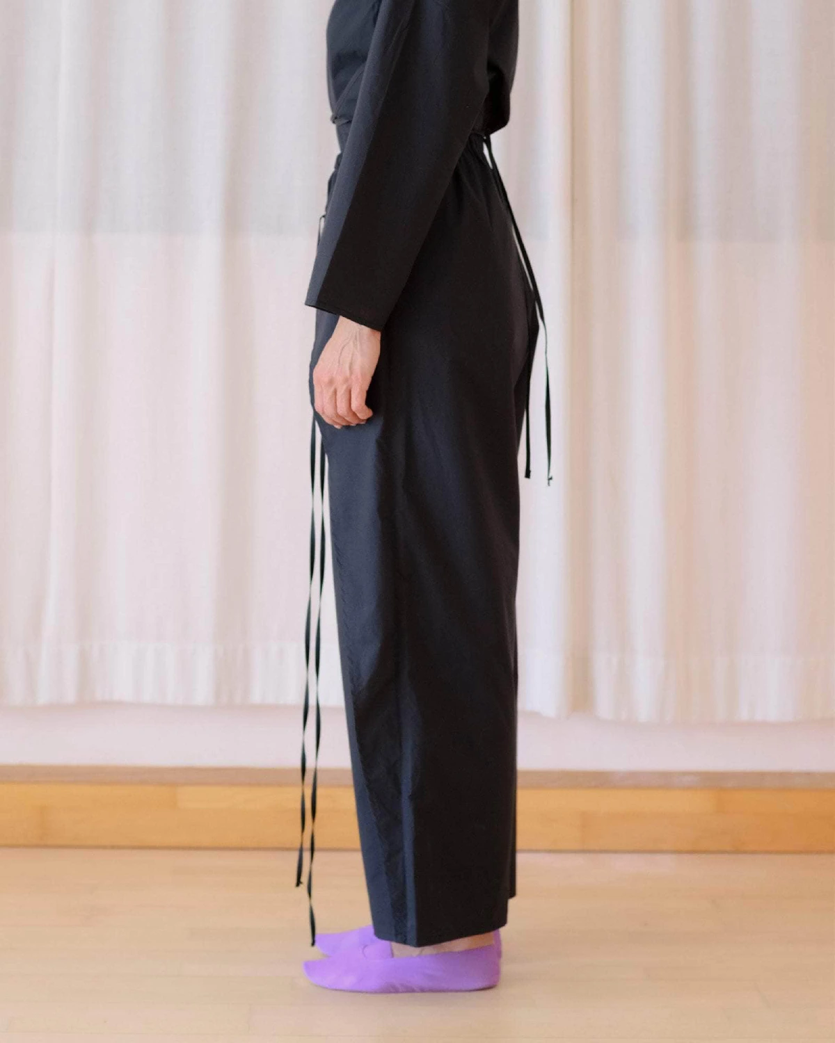 Baserange Decti Pants Black side view on model