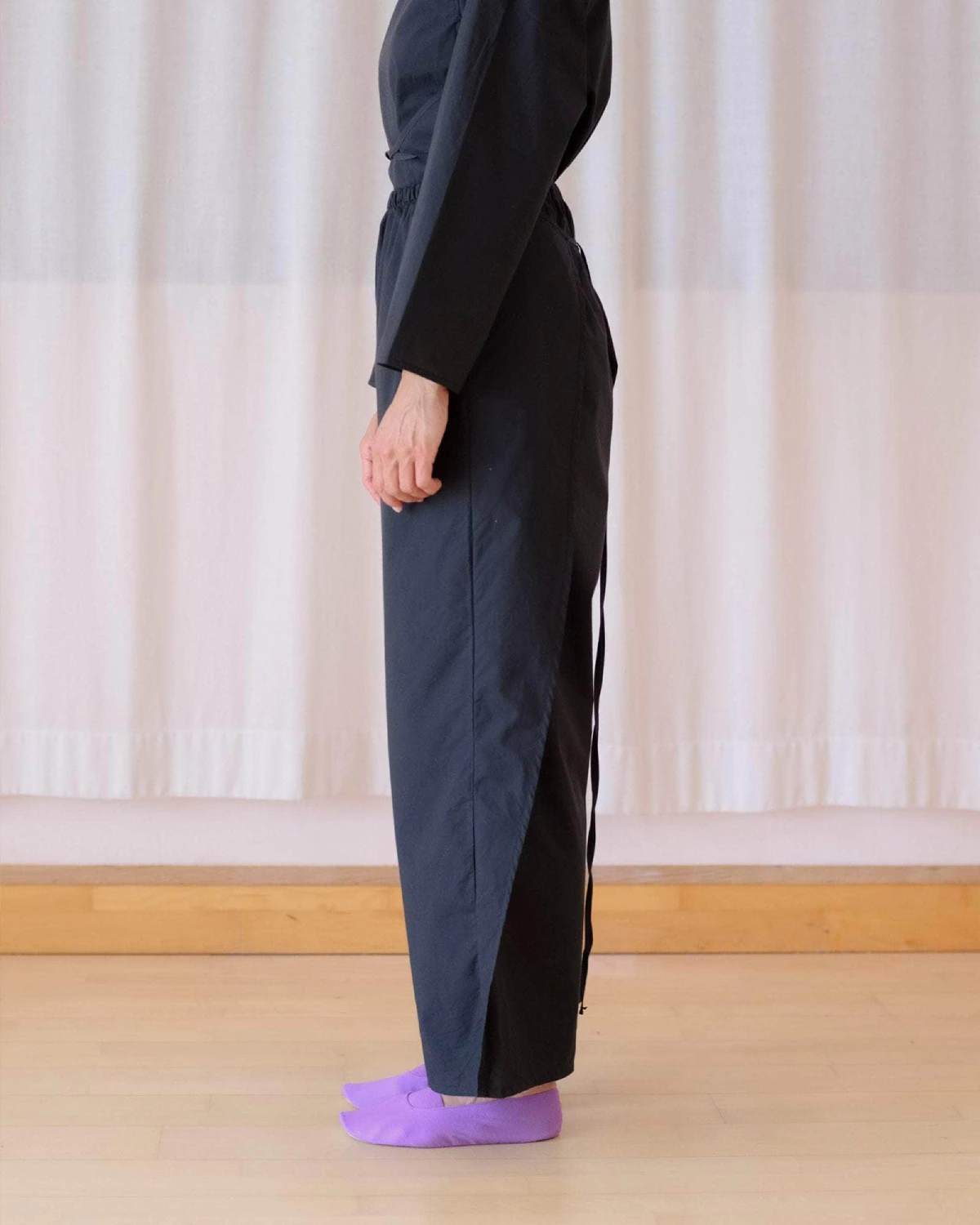 Baserange Decti Pants Black side view on model