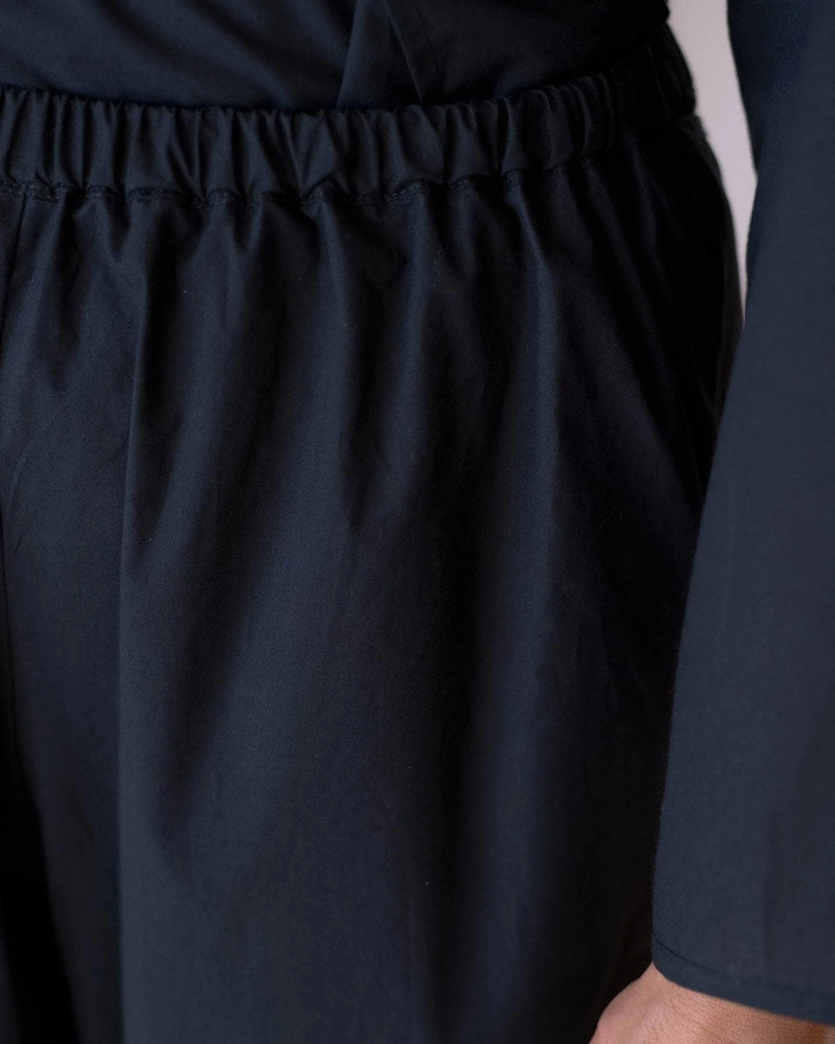 Baserange Decti Pants Black front view detail on model