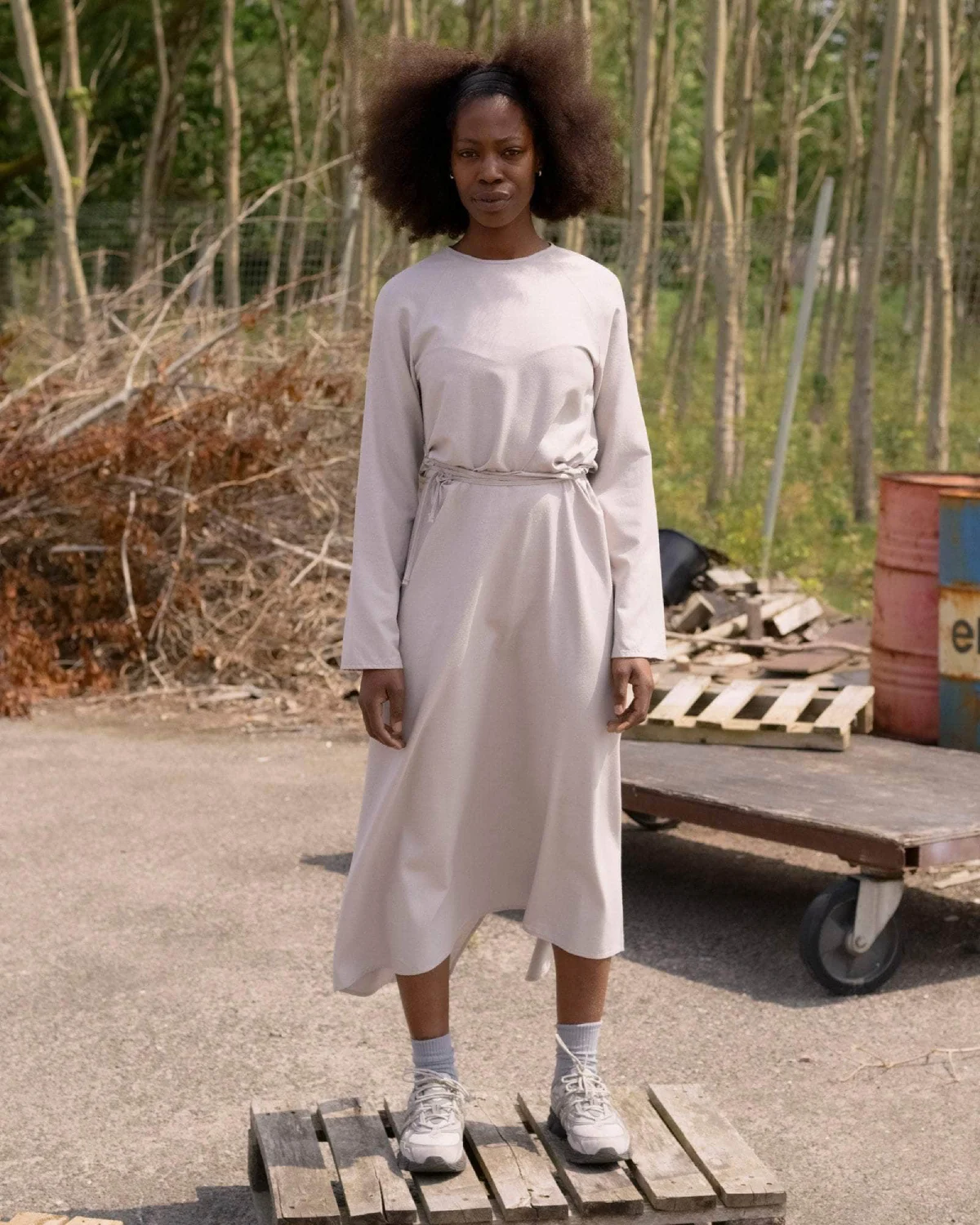 Baserange Long Sleeve Apron Dress Prun Grey front view on model