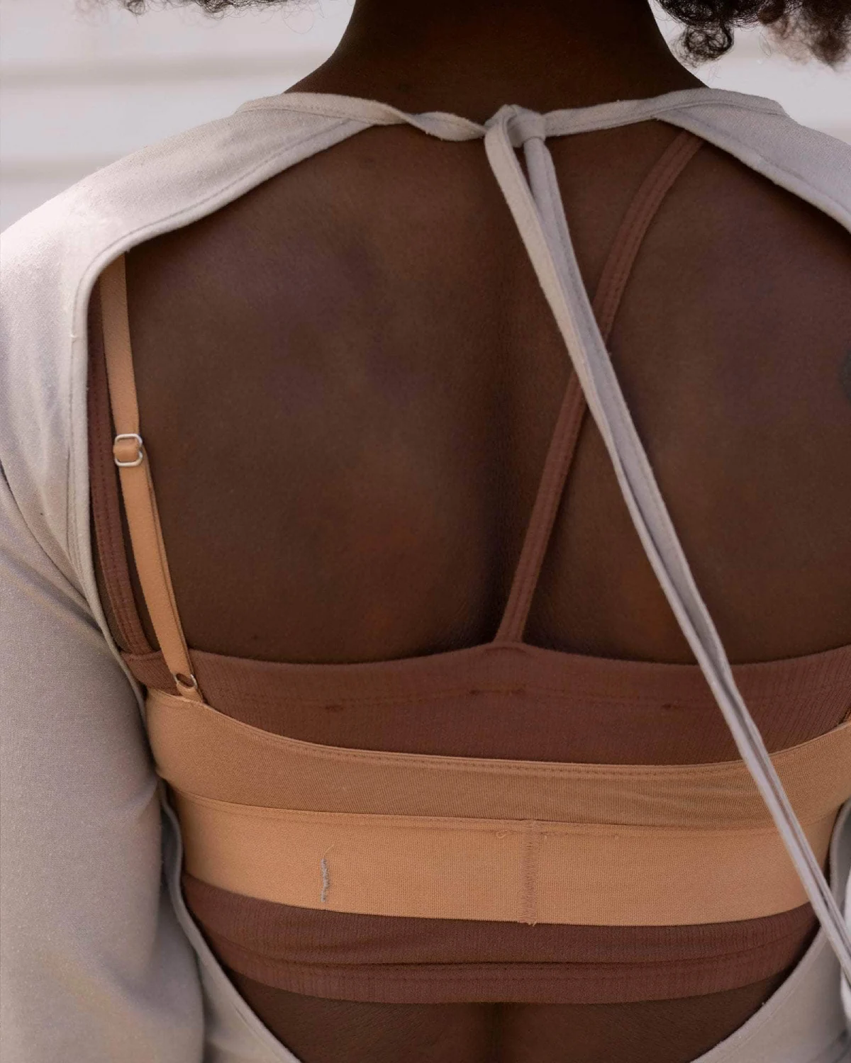 Baserange Long Sleeve Apron Dress Prun Grey back view on model