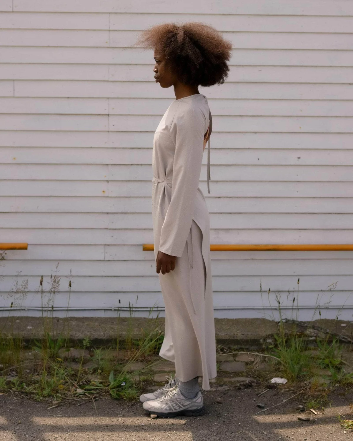 Baserange Long Sleeve Apron Dress Prun Grey side view on model