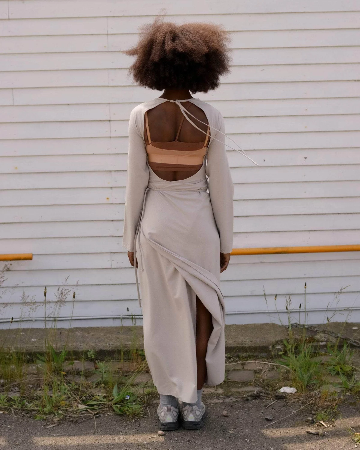 Baserange Long Sleeve Apron Dress Prun Grey back view on model