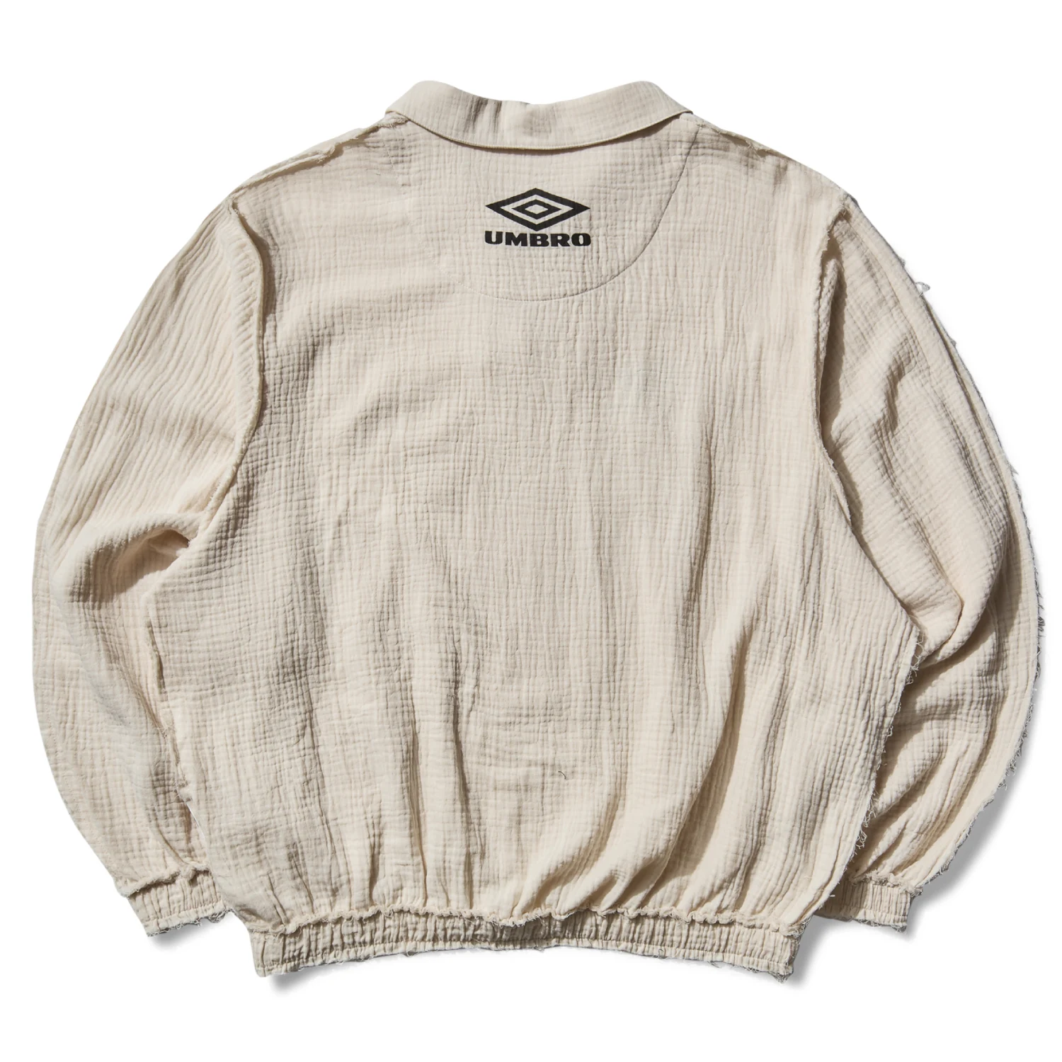 Umbro Slam Jam Union Drill Polo Porcelain White back view in a white background