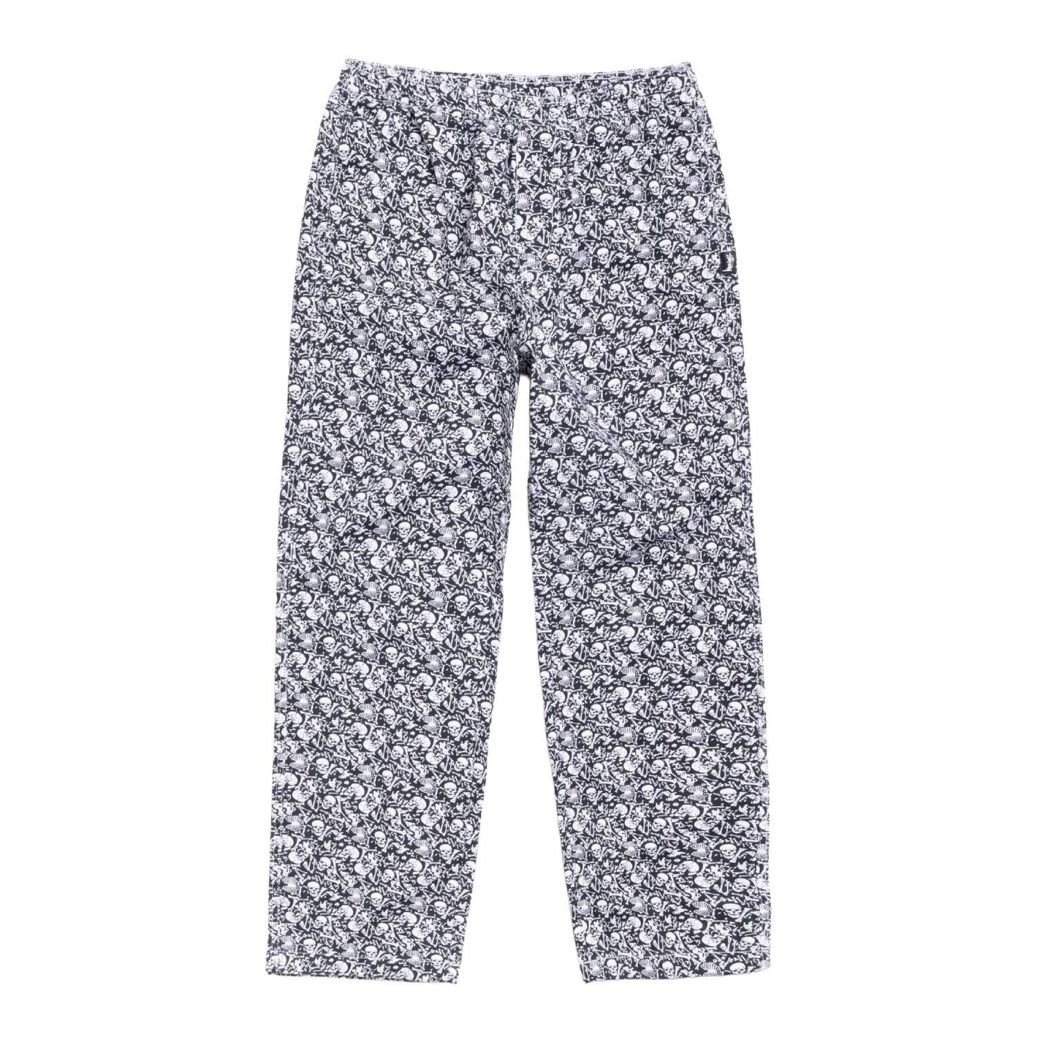 Stüssy Beach Pant Bones front view in a white background
