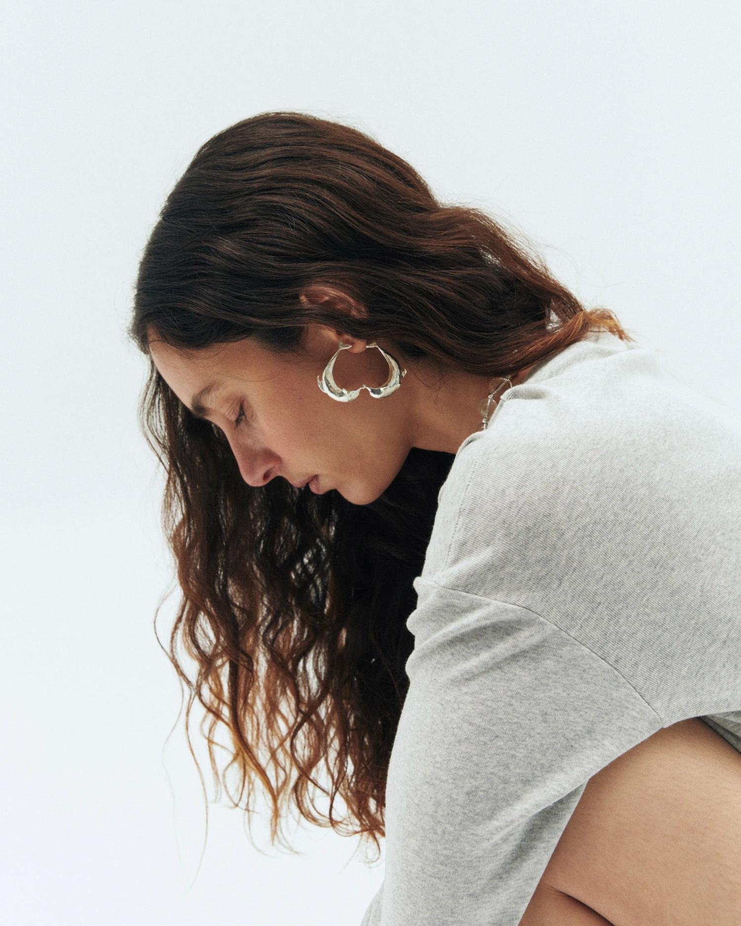 Simuero Los Delfines Hoop Earrings on model, side view