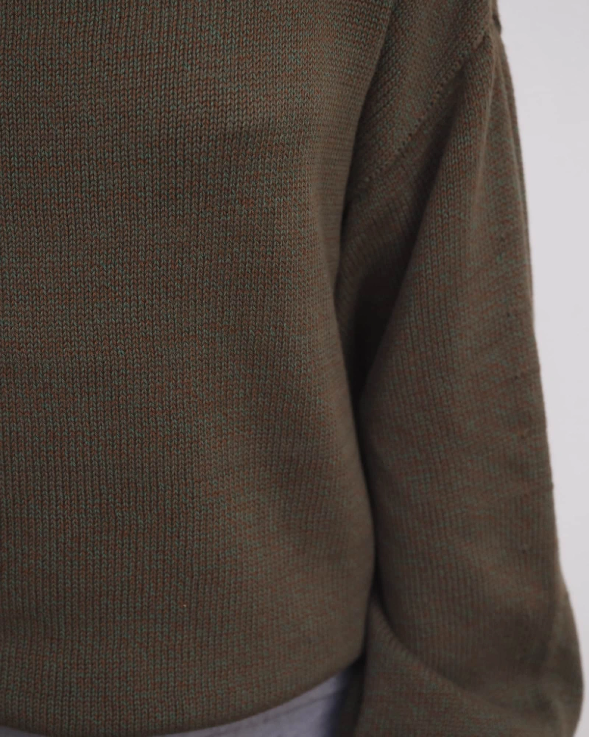 Baserange Calla Turtleneck Green Brown Melange detail on model