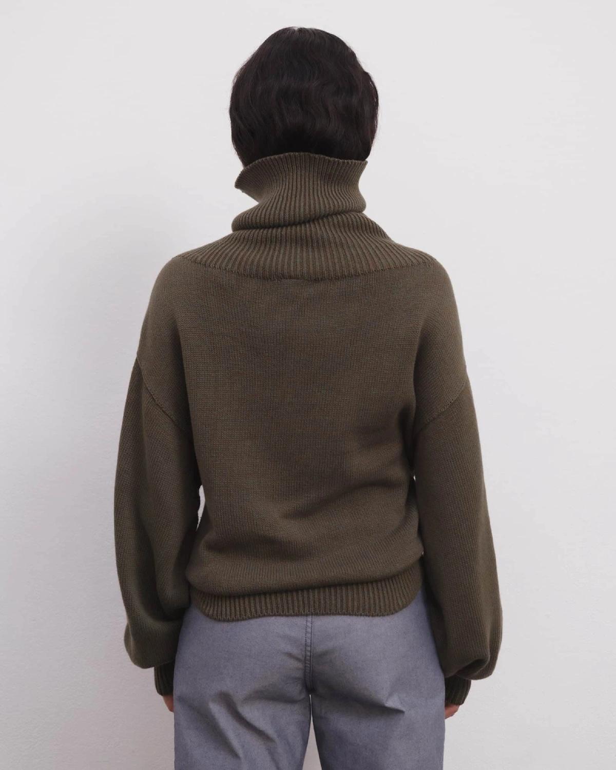 Baserange Calla Turtleneck Green Brown Melange back view on model