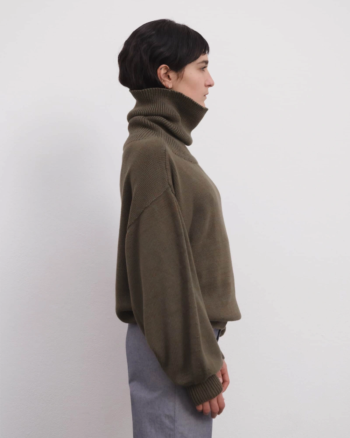 Baserange Calla Turtleneck Green Brown Melange side view on model