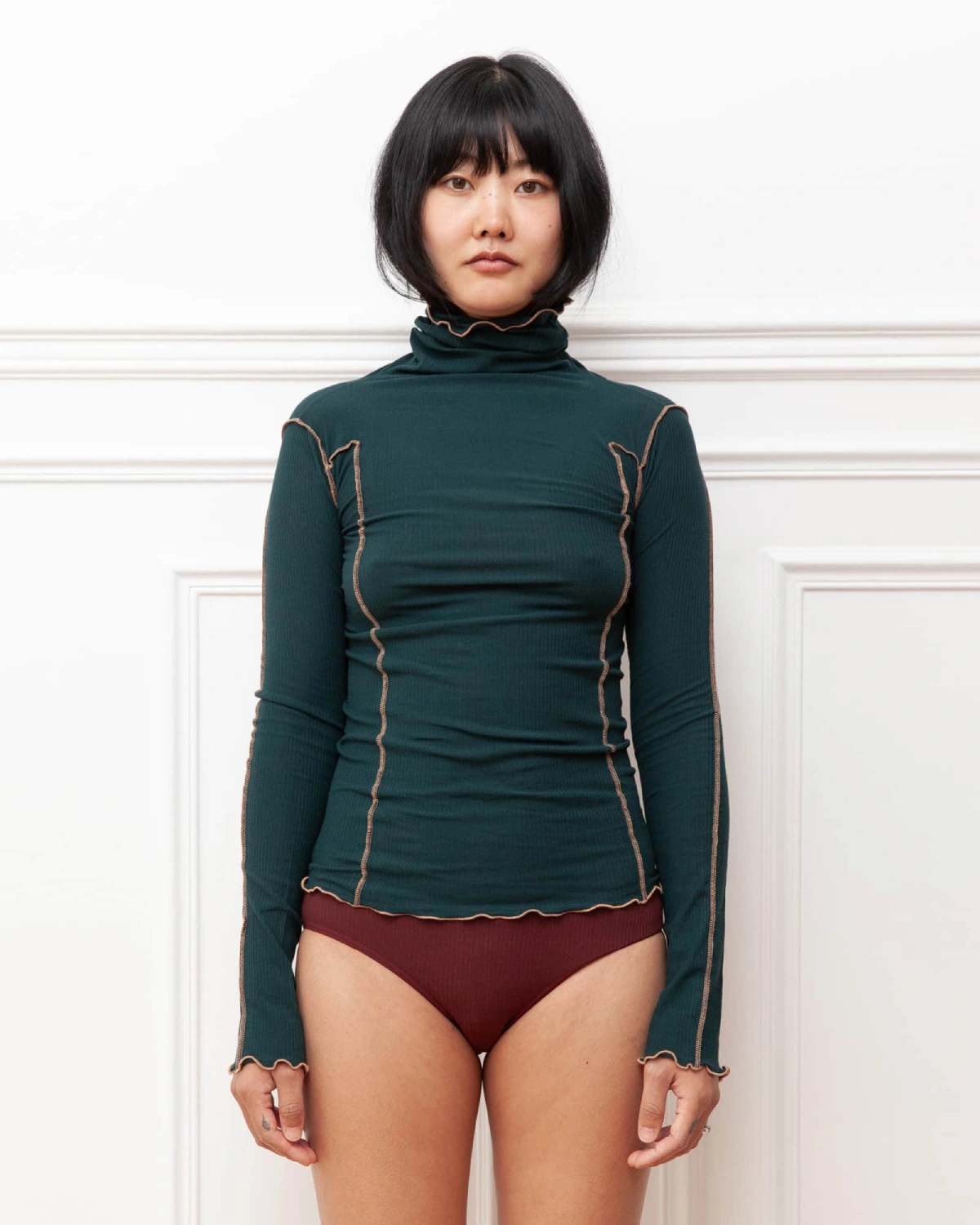 Baserange Omato Turtleneck Hirsu Green front view on model