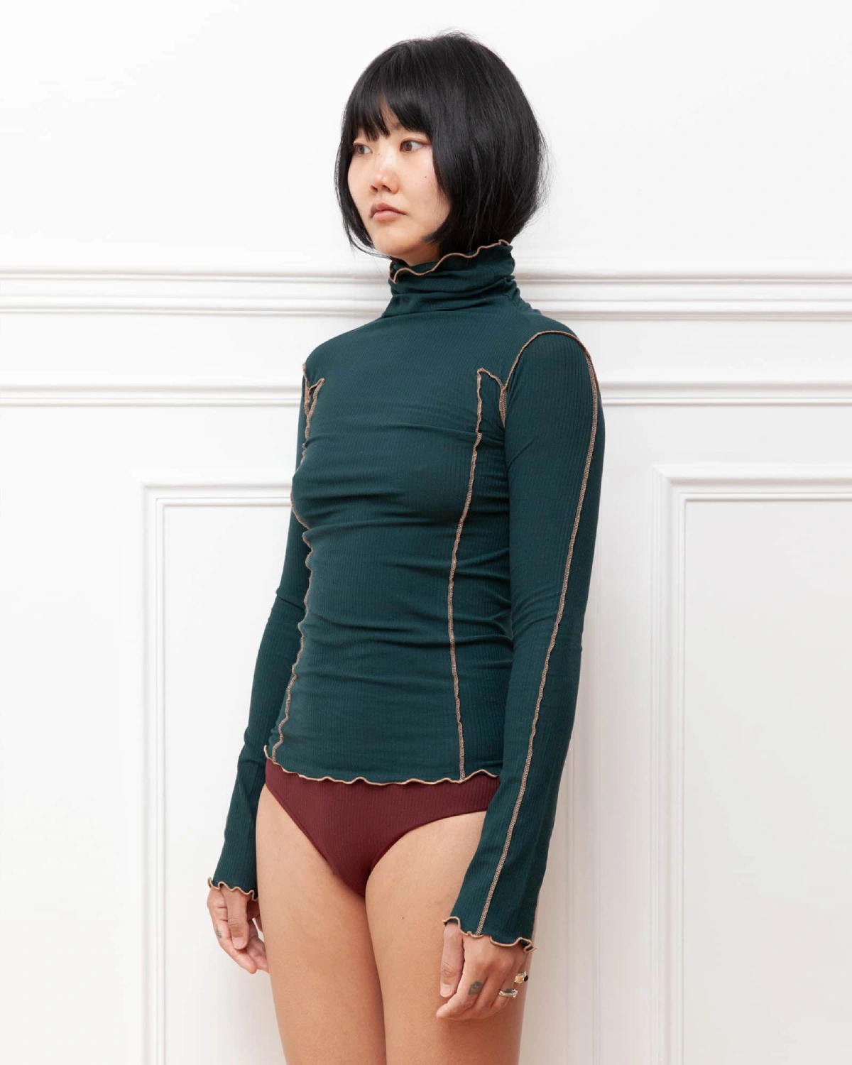 Baserange Omato Turtleneck Hirsu Green side view on model