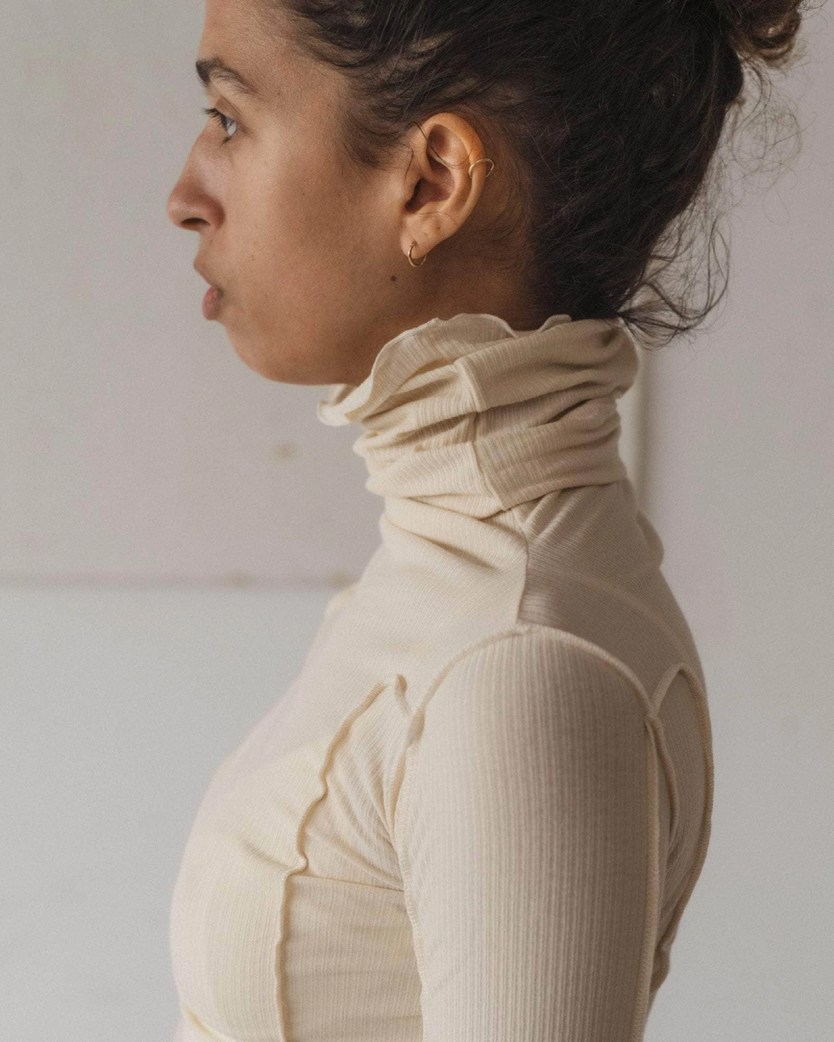 Baserange Omato Turtleneck Off White side view on model