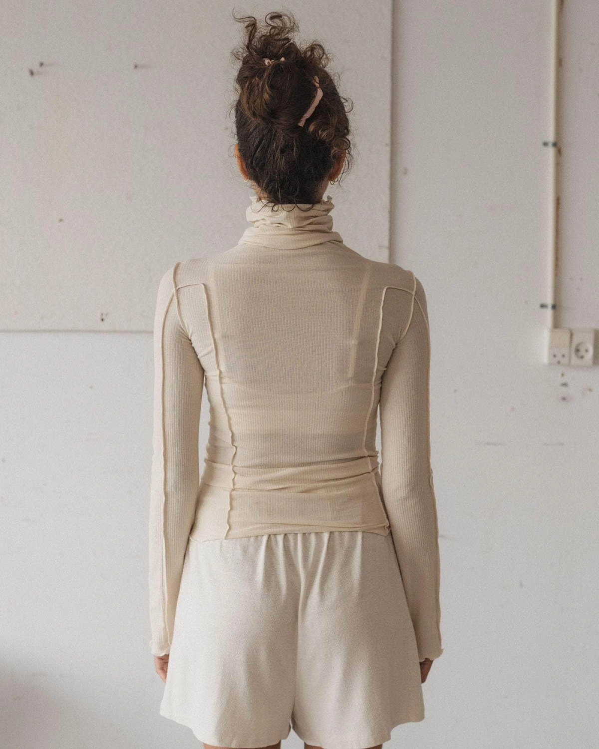Baserange Omato Turtleneck Off White back view on model