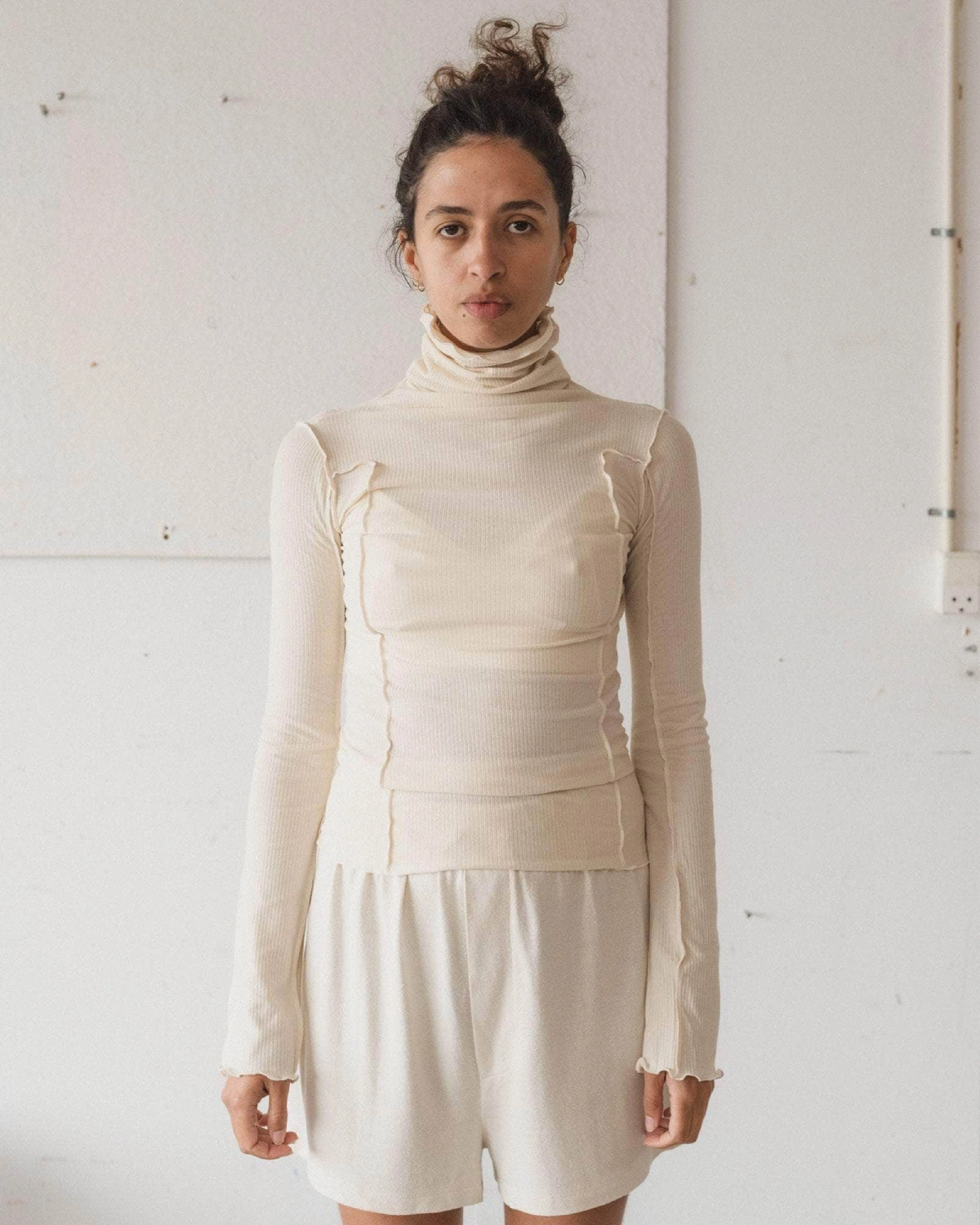 Baserange Omato Turtleneck Off White front view on model