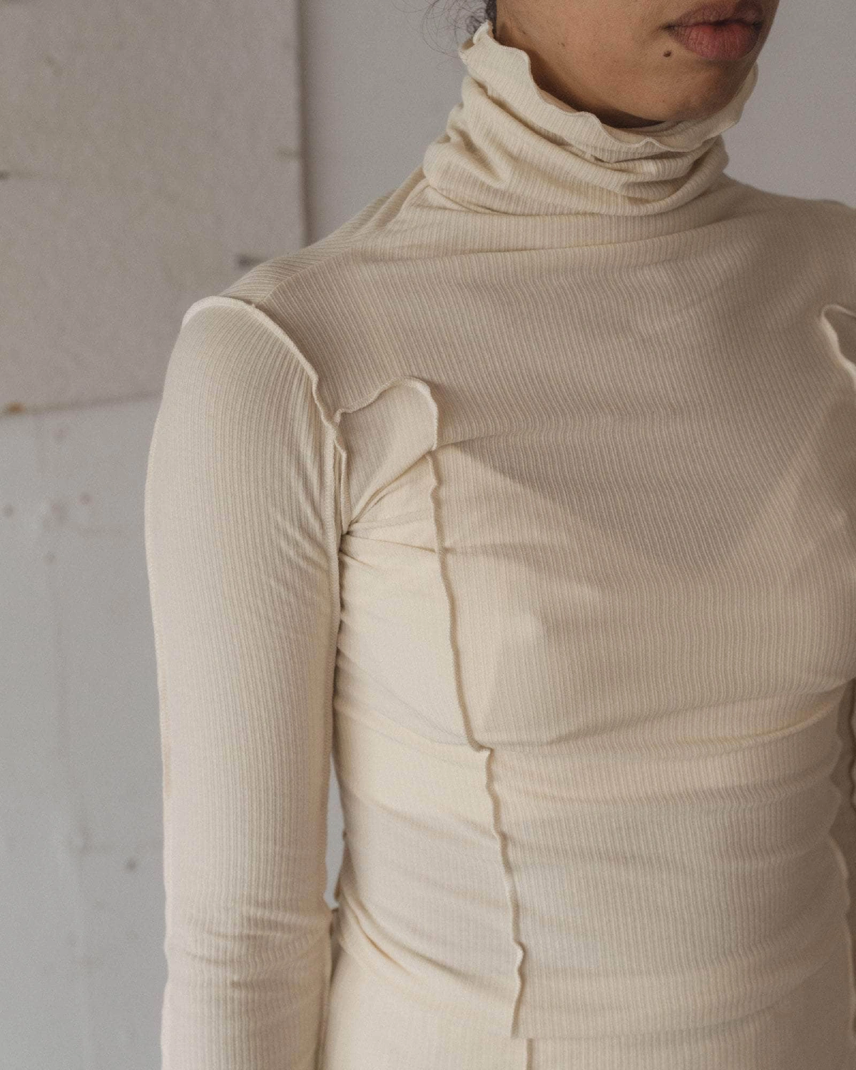 Baserange Omato Turtleneck Off White front view detail on model